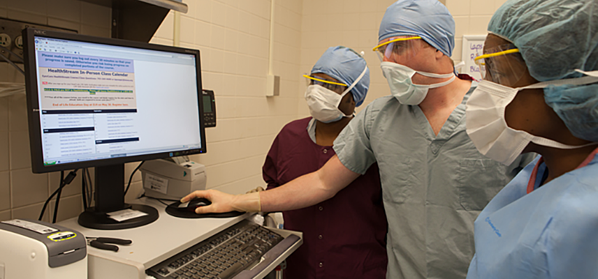 Image showing a Doctor and nurses examining Patient reports at a medical facility